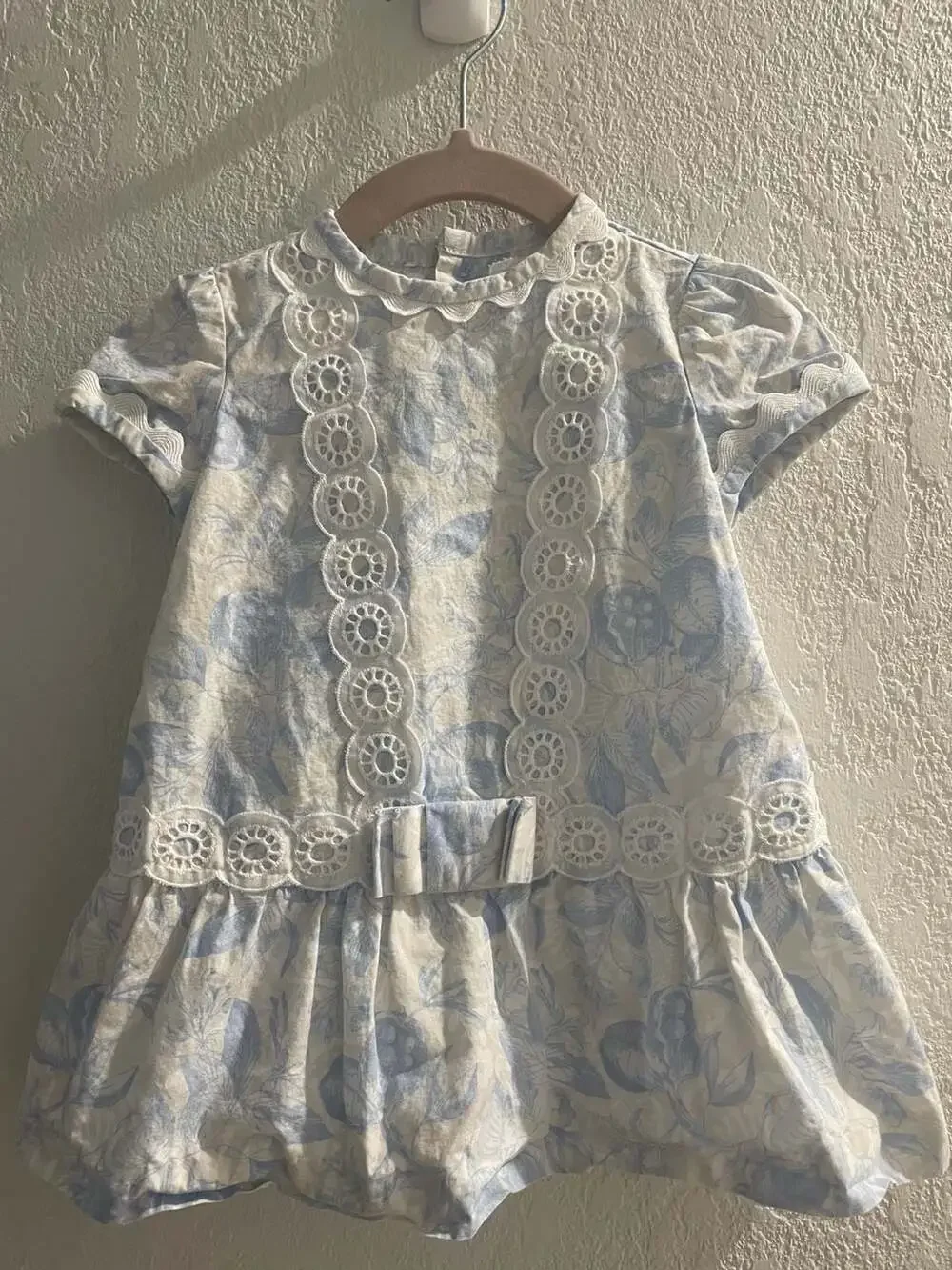 Cocote Tu Ropita Blue Floral Print Cotton Dress with Eyelet Trim and Bow Detail